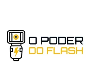 Fotógrafo profissional usando flash externo para iluminar um modelo, criando luz dramática.